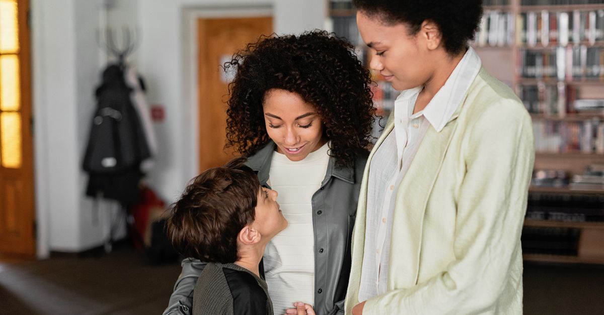 A parent and child with a staff member
