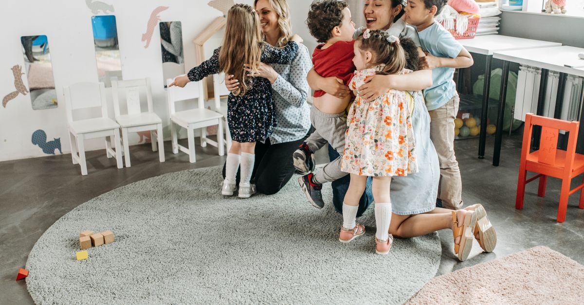 Teachers working with children in a classroom